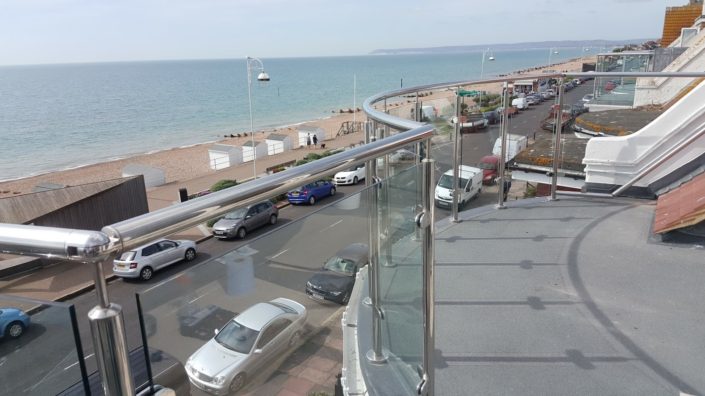 Mirror polished stainless steel glass balustrade installed for a client in Hastings