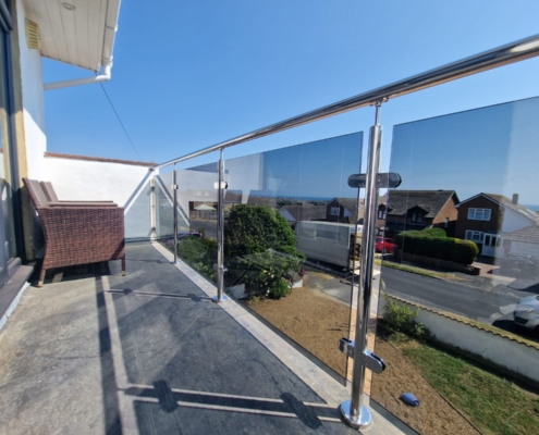Grey tint glass balustrade installed for a client in Peacehaven